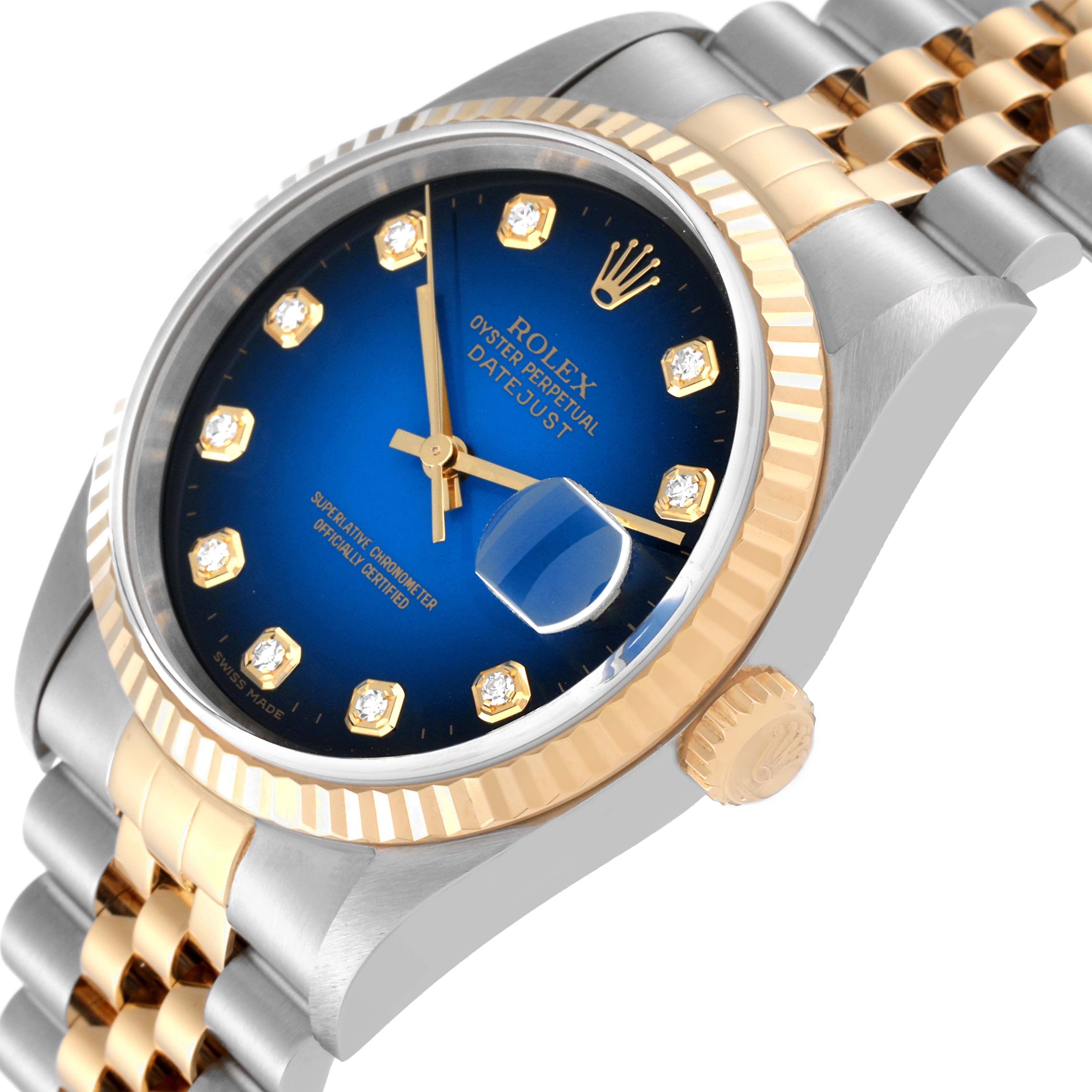 The image shows a close-up, angled view of a Rolex Datejust 16233G Men's Steel and Gold (two tone) Blue Dial 16233G Men's Steel and Gold (two tone) Blue Dial watch, highlighting its blue dial, jubilee bracelet, crown, and fluted bezel.