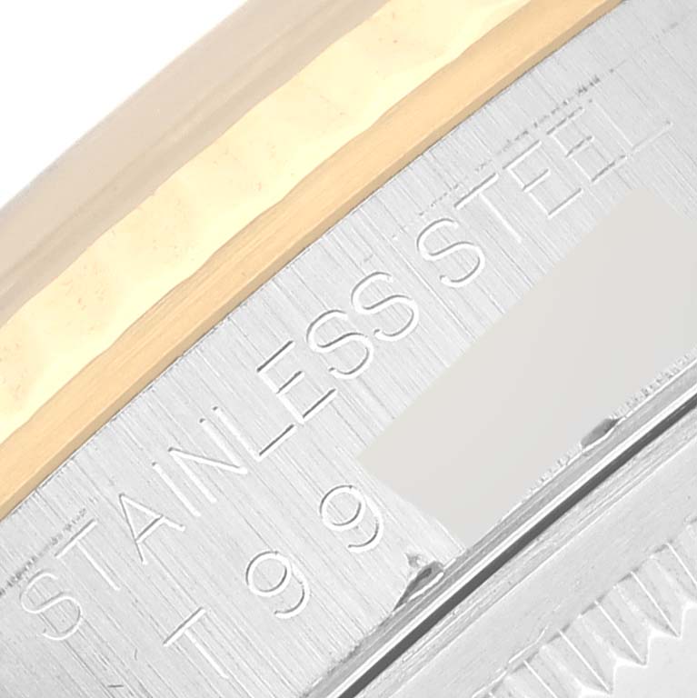 This image shows a close-up of the side engraving on a Rolex Datejust 16233G Men's Steel and Gold (two tone) Blue Dial 16233G Men's Steel and Gold (two tone) Blue Dial model, highlighting the "STAINLESS STEEL" inscription.