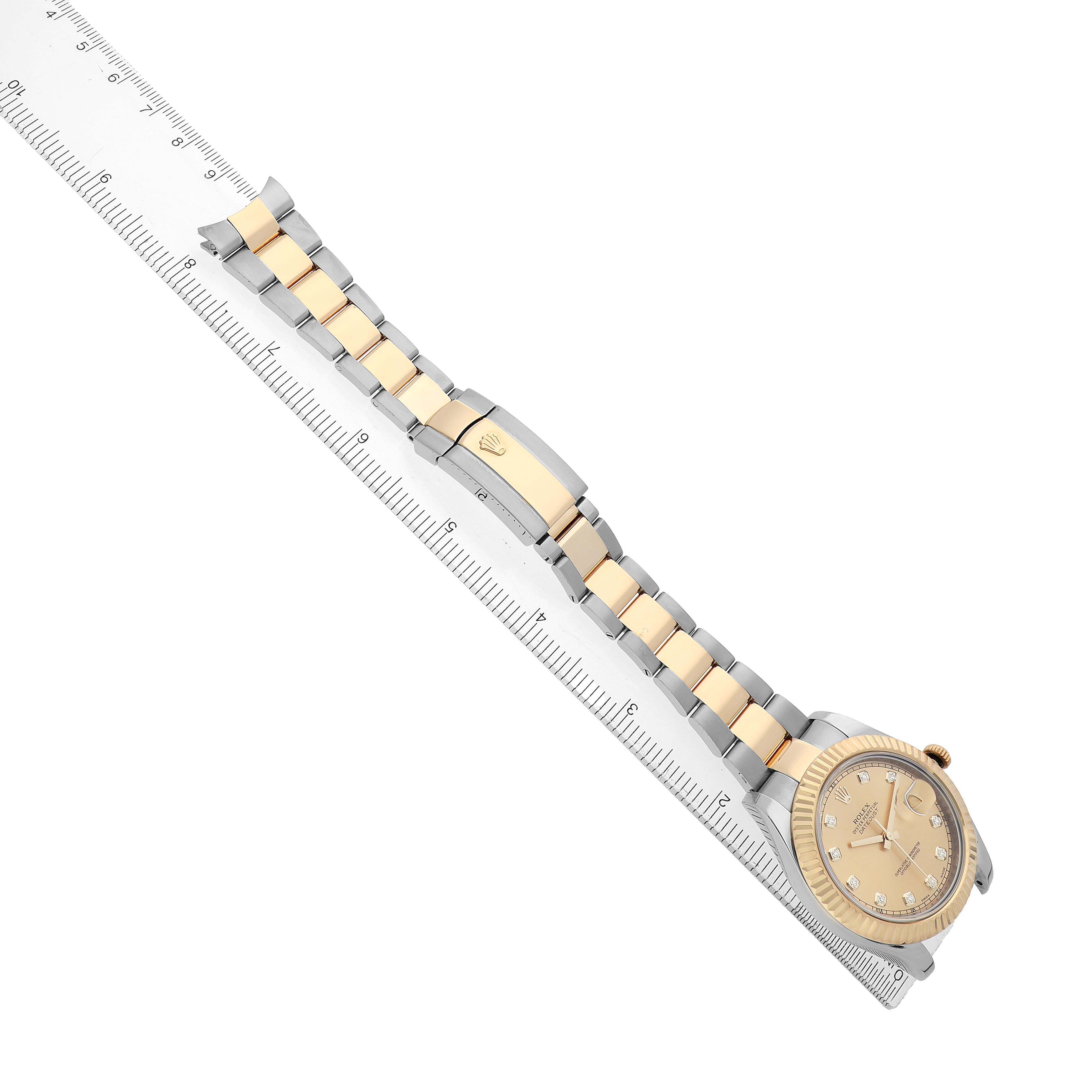 The Rolex Datejust 41 116333 Men's Steel and Gold (two tone) Champagne Dial is displayed diagonally, showing the face and two-tone bracelet aligned along a ruler.