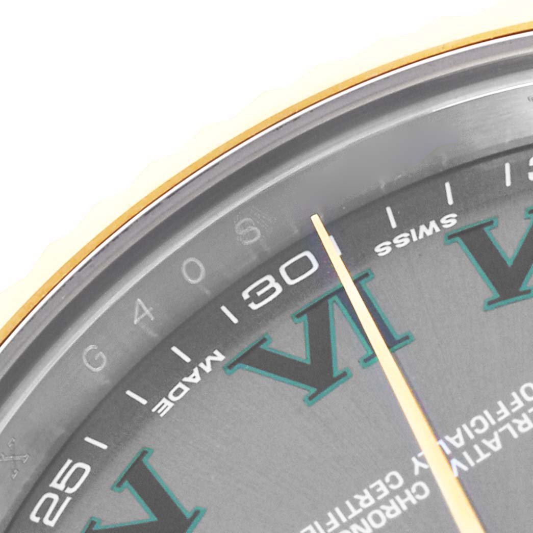 The image shows a close-up of the dial and minute hand of a Rolex Datejust 41 116333 Men's Steel and Gold (two tone) Grey Dial 116333 Men's Steel and Gold (two tone) Grey Dial, featuring Roman numerals and part of the bezel.