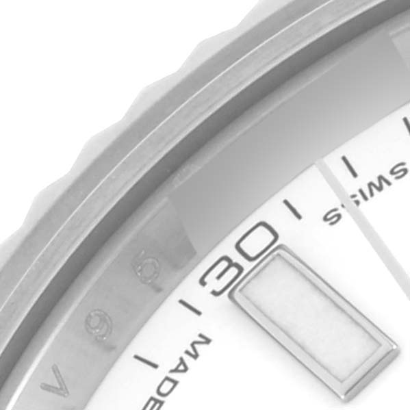 The image shows a close-up of the Rolex Datejust 41 116334 Men's Stainless Steel White Dial 116334 Men's Stainless Steel White Dial's bezel, part of the dial, and the date window at the 30 marker.