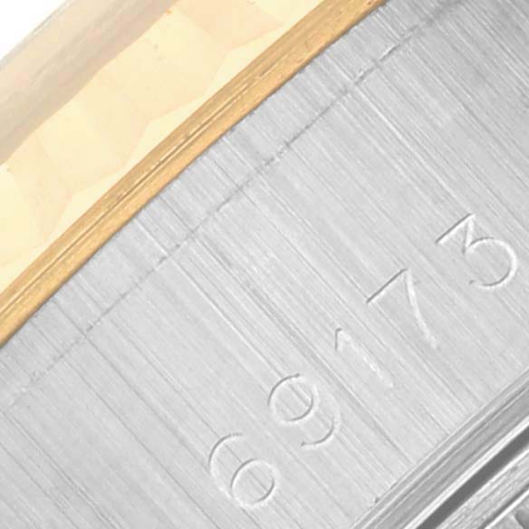 The image shows a close-up of the case edge and model number engraving on the Rolex Datejust 69173 Women's Steel and Gold (two tone) Beige Dial 69173 Women's Steel and Gold (two tone) Beige Dial.