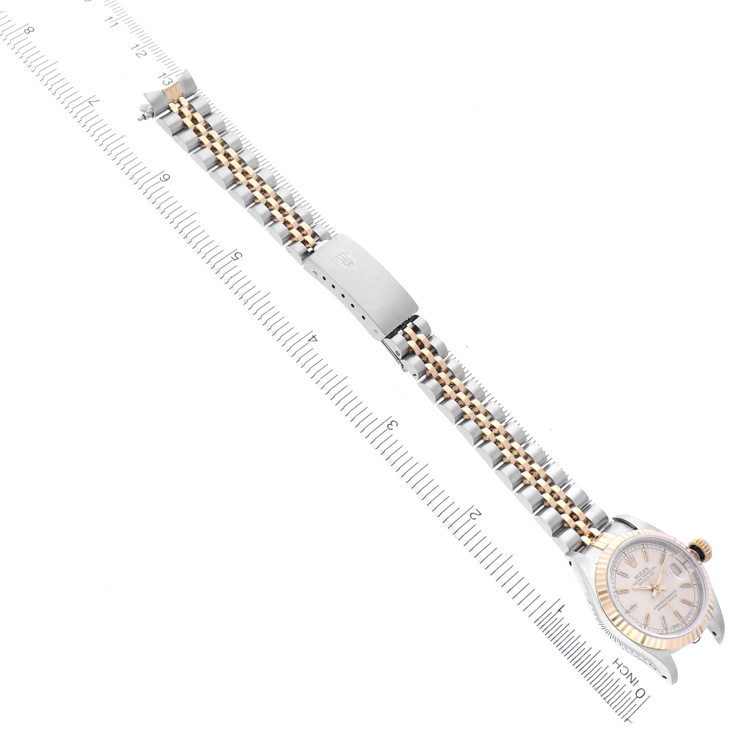 The Rolex Datejust 69173 Women's Steel and Gold (two tone) Beige Dial 69173 Women's Steel and Gold (two tone) Beige Dial watch is shown from a top view, displaying the bracelet, clasp, and case.