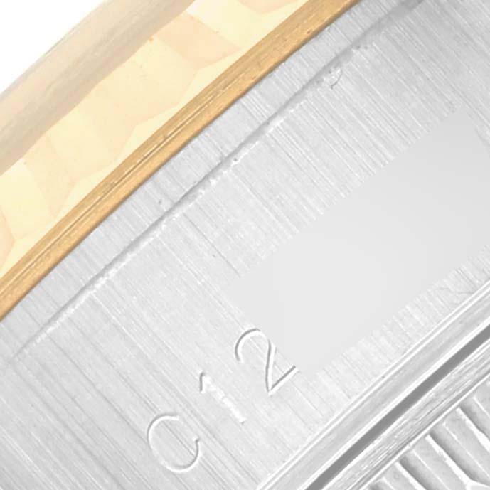 The image shows a close-up of the side and edge details of the Rolex Datejust 69173 Women's Steel and Gold (two tone) Beige Dial 69173 Women's Steel and Gold (two tone) Beige Dial bezel and case.