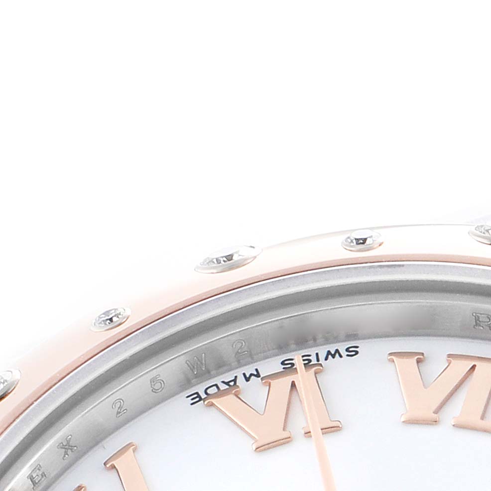 The image shows a close-up of a Rolex Mid-Size 178341 Women's Steel and Gold (two tone) White Dial model's bezel and dial, highlighting the Roman numerals and "Swiss Made" text.