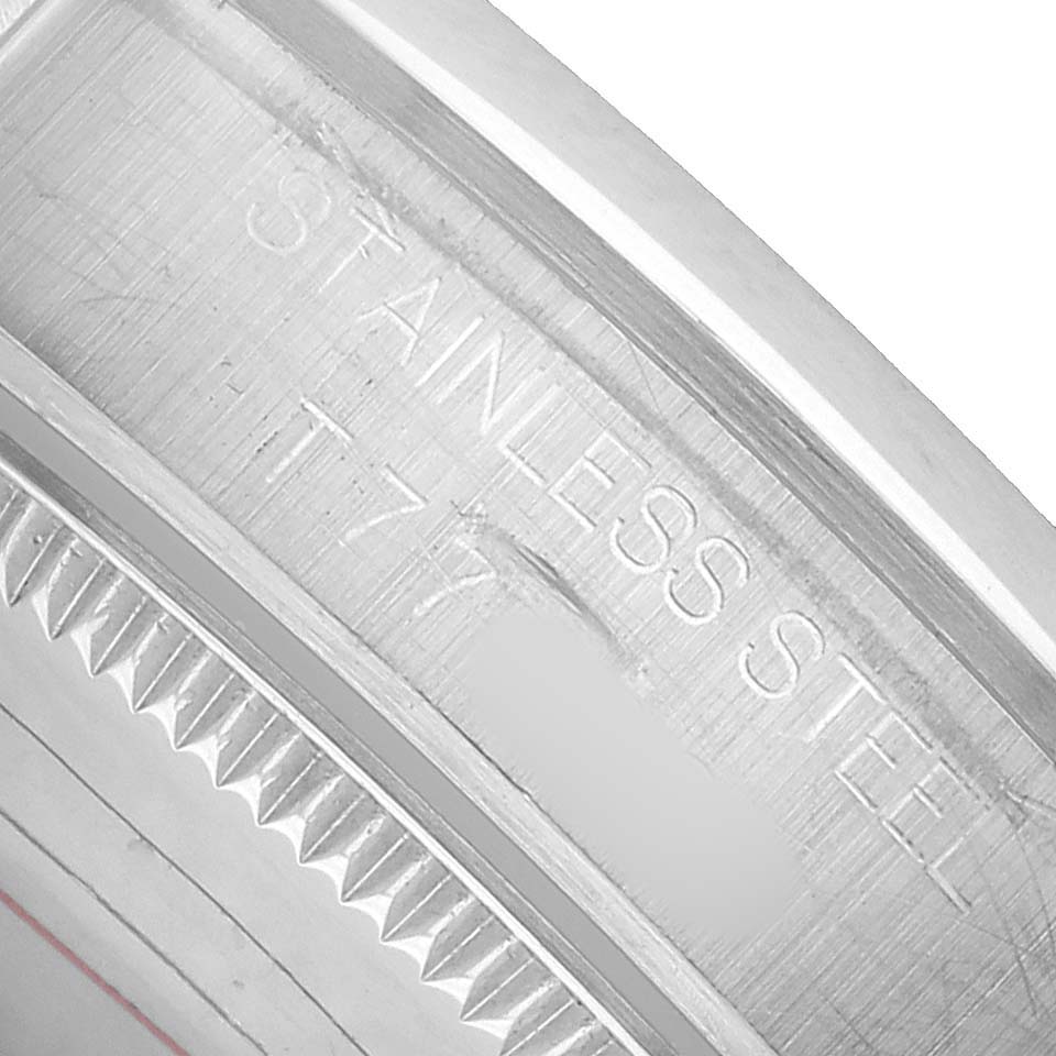 The image shows the side engraving on the bezel of a Rolex Datejust 68240 Women's Stainless Steel Pink Dial watch, emphasizing the stainless steel material.