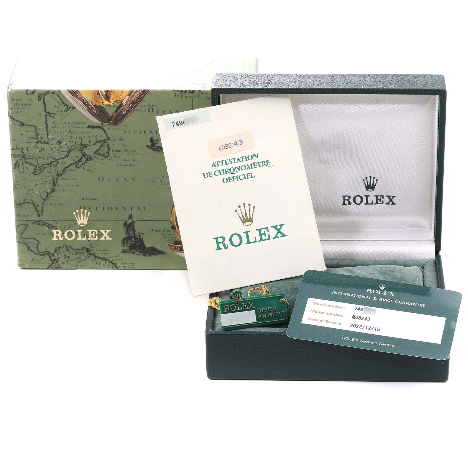The image shows a Rolex Mid-Size 68243 Women
s Steel and Gold (two tone) Champagne Dial 68243 Women
s Steel and Gold (two tone) Champagne Dial model watch box, papers, and service guarantee card arranged at an angle, with the lid open.