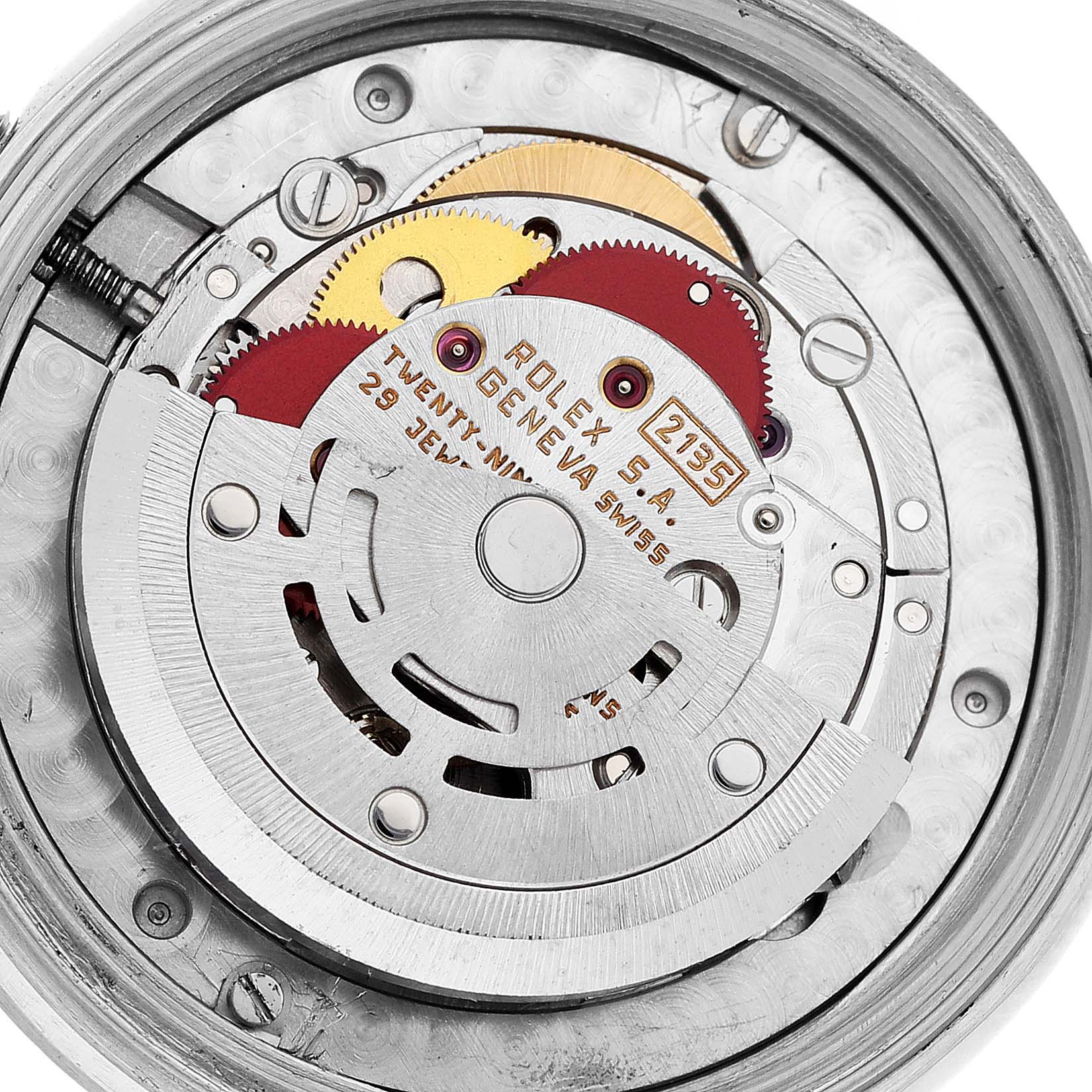 This image shows an up-close view of the internal mechanism of a Rolex Mid-Size 68274 Women
s Stainless Steel Silver Dial 68274 Women
s Stainless Steel Silver Dial model watch, displaying gears and the rotor.