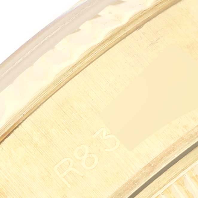 This close-up angle shows the inner edge of a Rolex President 69178 Women's Yellow Gold Champagne Dial 69178 Women's Yellow Gold Champagne Dial model watch, highlighting engraved markings.