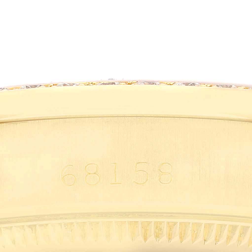 This close-up image shows the serial number and fluted bezel of a Rolex President 68158 Women
s Yellow Gold Champagne Dial 68158 Women
s Yellow Gold Champagne Dial model watch.