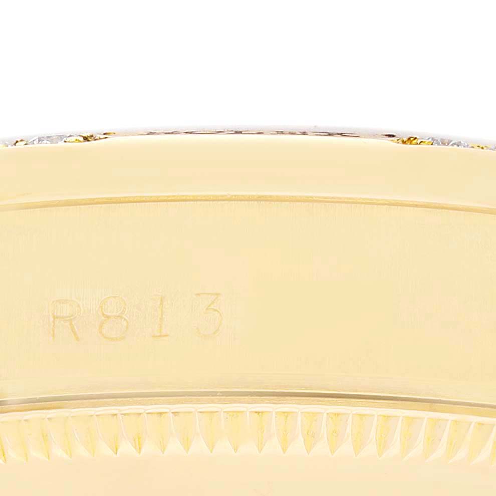 This close-up image shows the side view of the case and bezel of the Rolex President 68158 Women
s Yellow Gold Champagne Dial 68158 Women
s Yellow Gold Champagne Dial model watch, with part of the model number visible.
