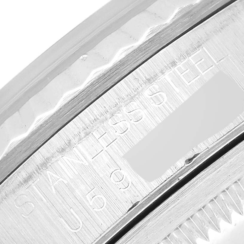 This is a close-up of the casing edge, showing the engraved serial number and "STAINLESS STEEL" on the Rolex Datejust 16234 Men's Stainless Steel Silver Dial 16234 Men's Stainless Steel Silver Dial watch.