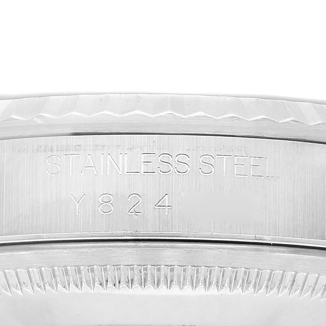 This image shows a close-up of the stainless steel engraving and serial number on the Rolex Datejust 16234 Men's Stainless Steel Black Dial 16234 Men's Stainless Steel Black Dial watch case.
