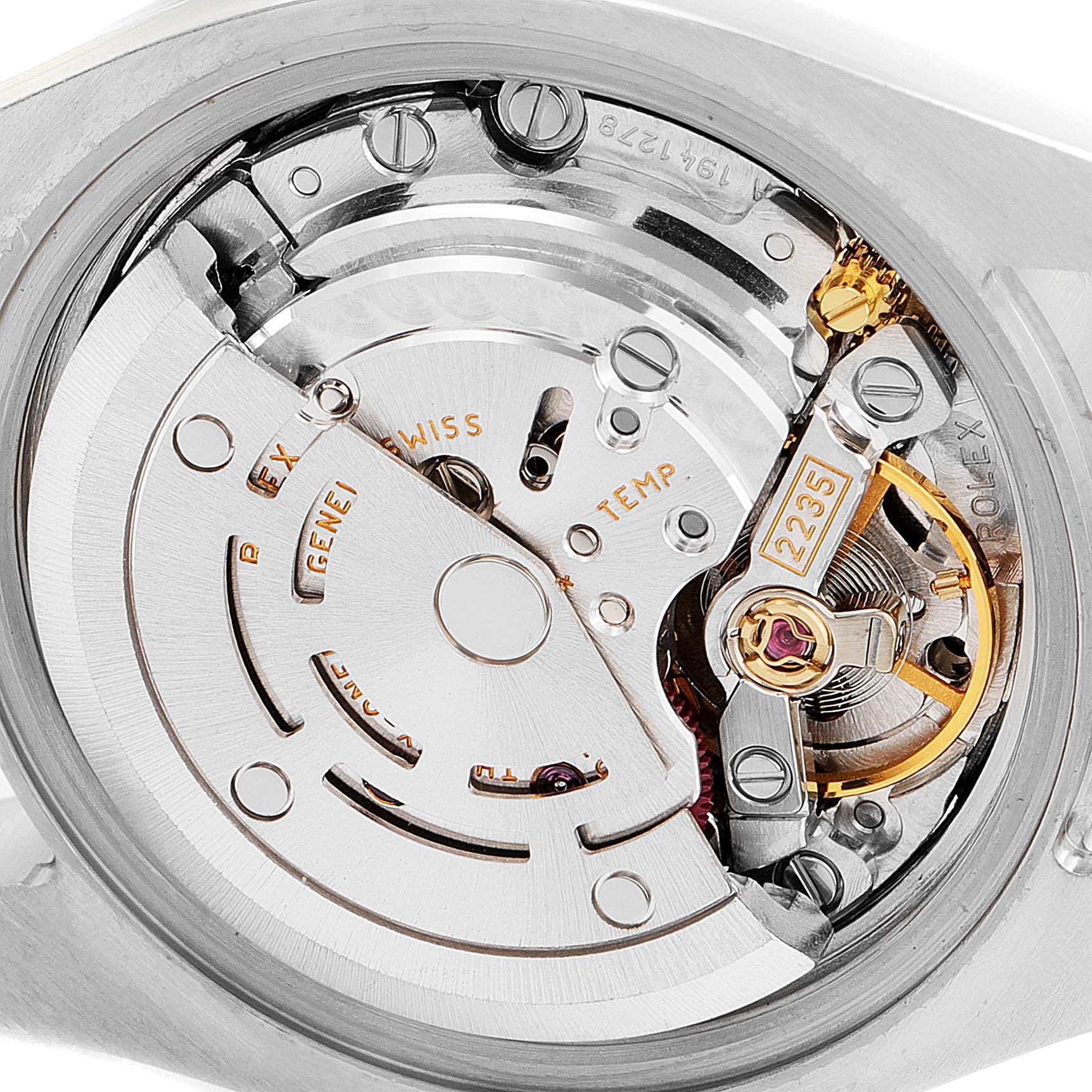 The image shows an internal view of the Rolex Datejust 179174 Women's Stainless Steel Silver Dial 179174 Women's Stainless Steel Silver Dial movement, highlighting the rotor and escapement.