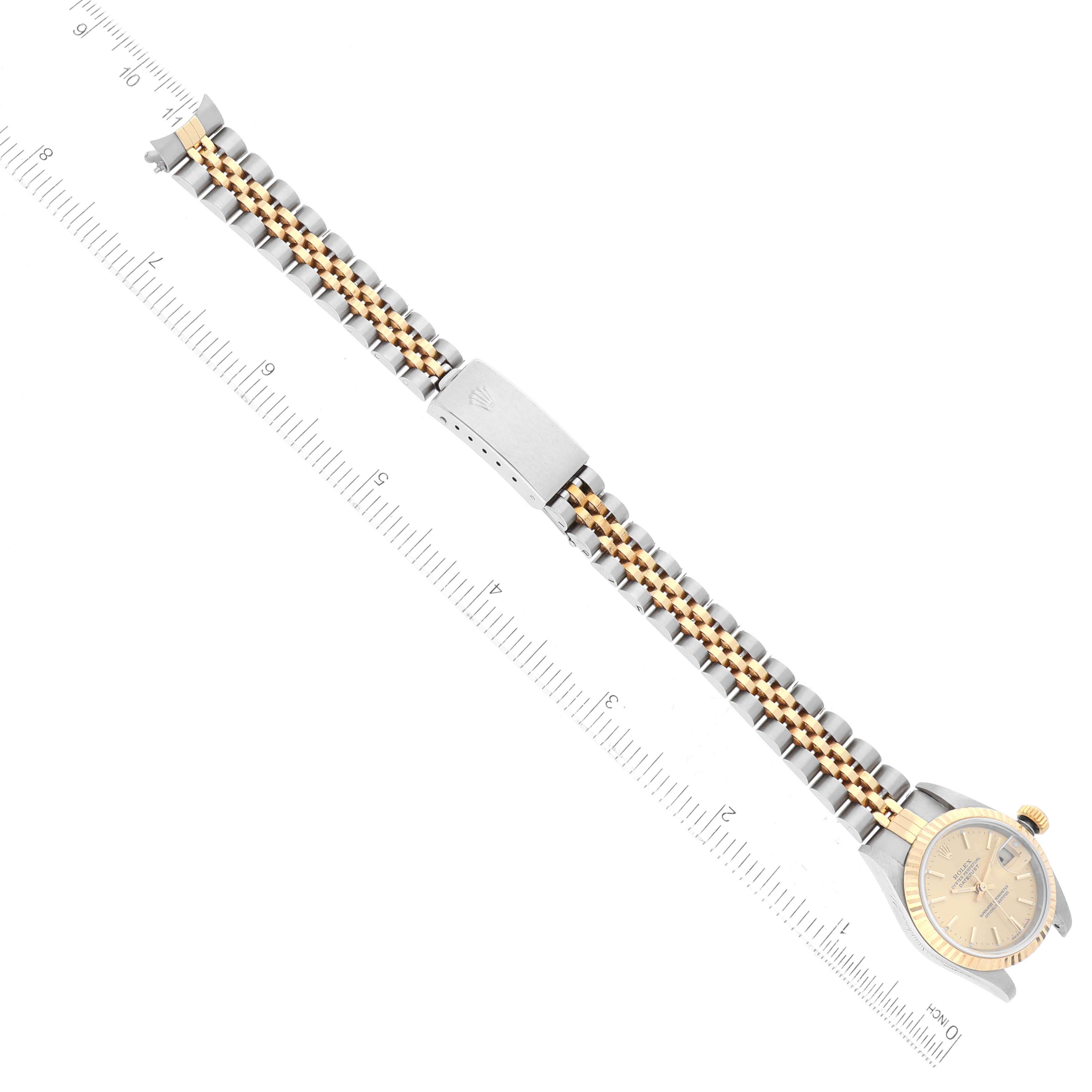 This image shows a Rolex Datejust 79173 Women's Steel and Gold (two tone) Champagne Dial 79173 Women's Steel and Gold (two tone) Champagne Dial watch from a top-down angle, highlighting the bracelet and clasp.