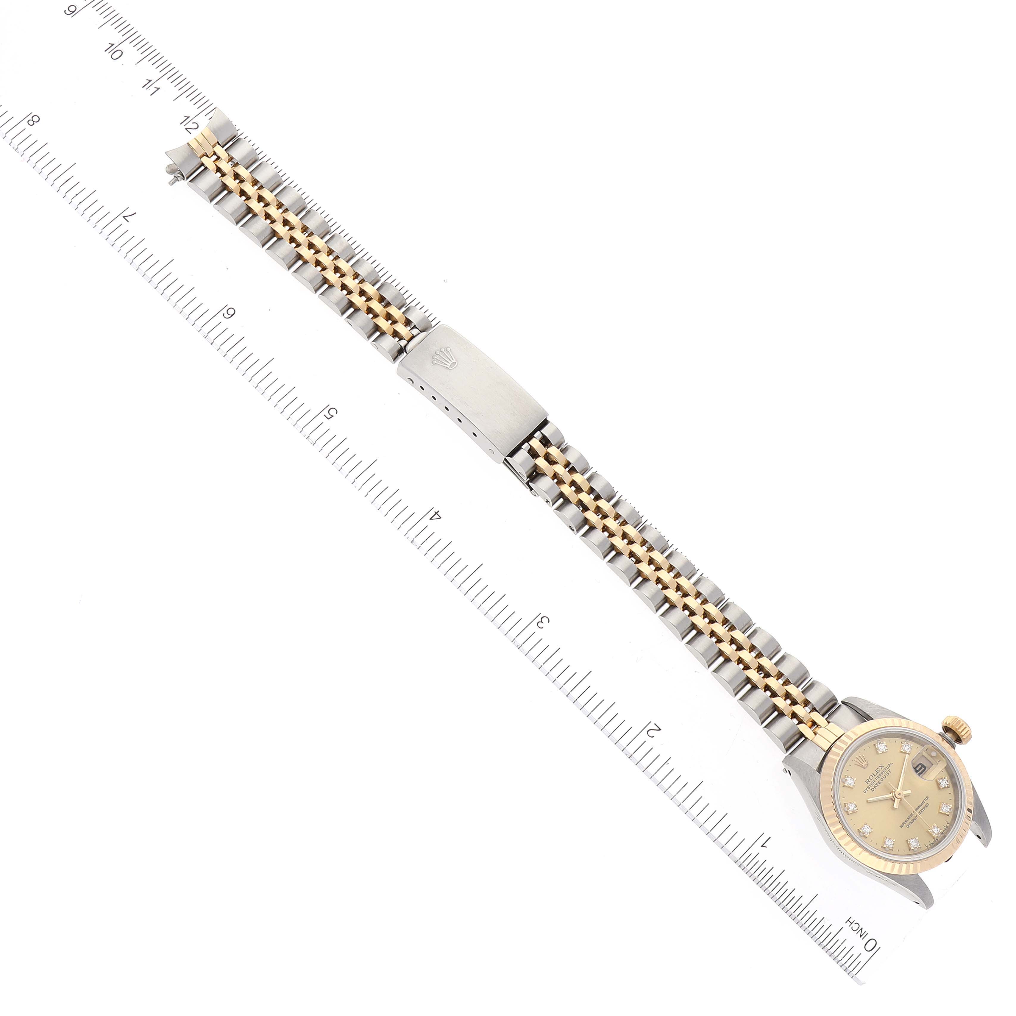 The image shows a Rolex Datejust 69173 Women's Steel and Gold (two tone) Champagne Dial 69173 Women's Steel and Gold (two tone) Champagne Dial watch from a top-down angle displaying the face, bracelet, and clasp.