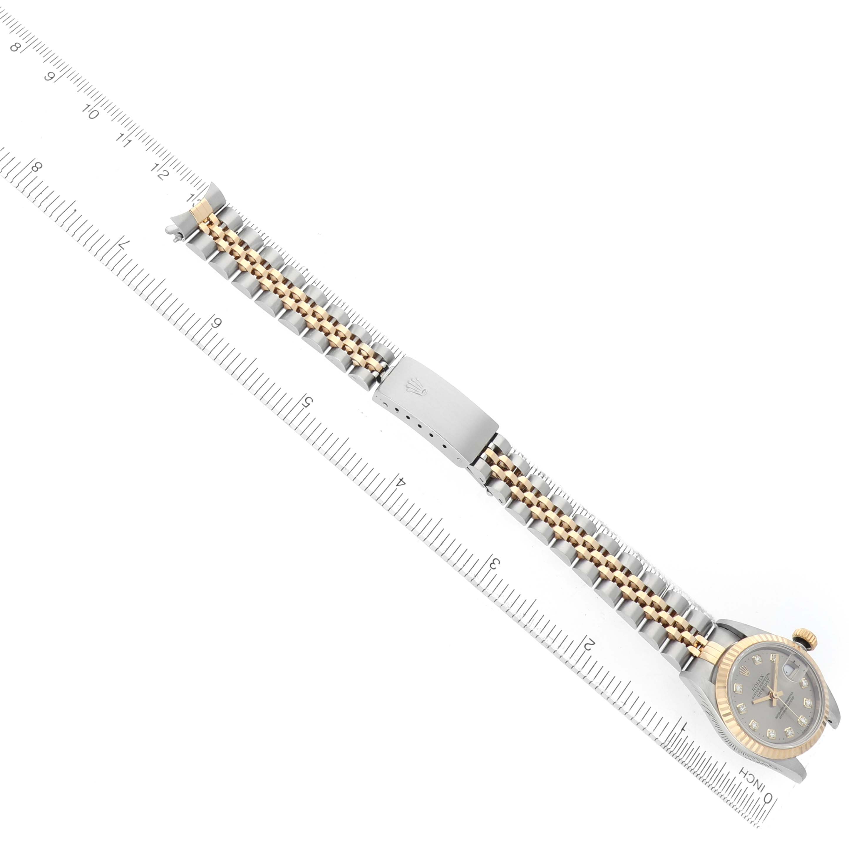 The image shows a Rolex Datejust 69173 Women's Steel and Gold (two tone) Grey Dial watch laid flat with the dial, bracelet, and clasp visible, alongside a measuring ruler.