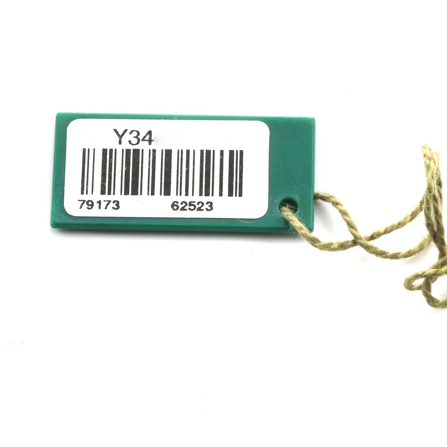 The image shows a green tag with a barcode and numbers likely associated with a Rolex Datejust 79173 Women's Steel and Gold (two tone) Champagne Dial watch accessory.