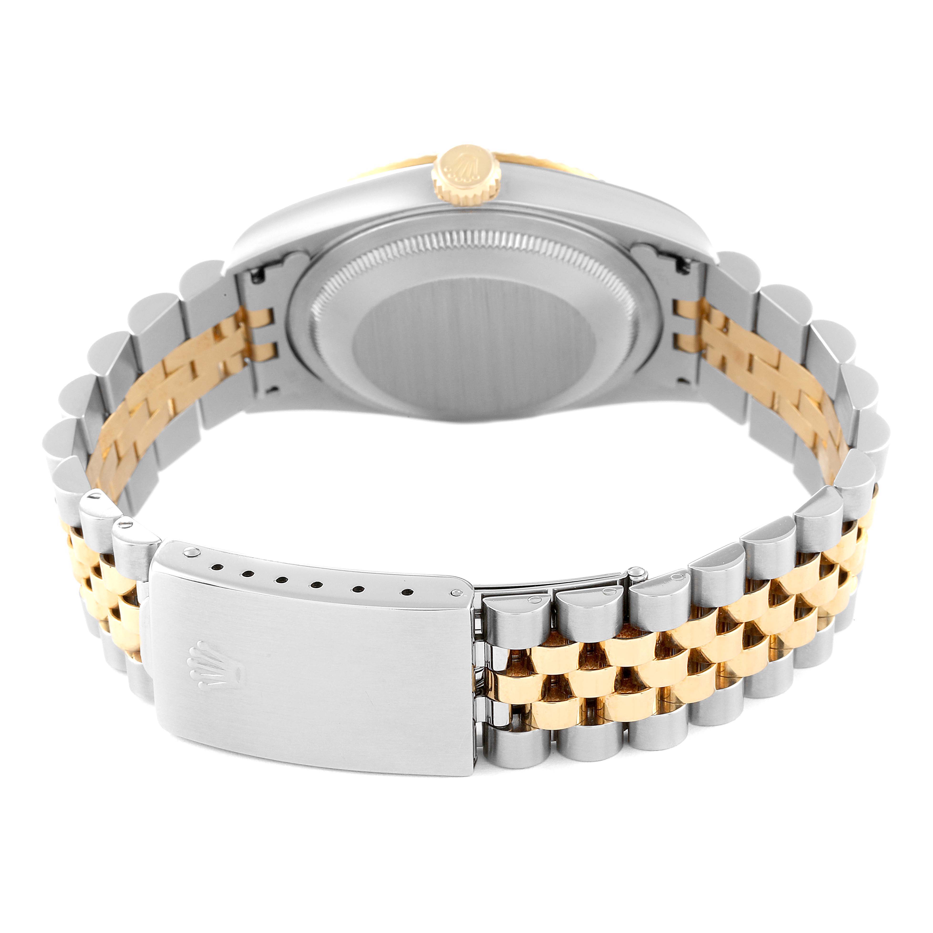 This image shows the back view of a Rolex Datejust 16233 Men's Steel and Gold (two tone) Silver Dial 16233 Men's Steel and Gold (two tone) Silver Dial watch, highlighting its case back, crown, and two-tone bracelet with the clasp.