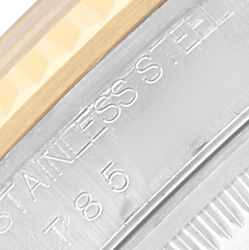 The image shows a close-up of the case edge and bezel of a Rolex Datejust 16233 Men's Steel and Gold (two tone) Grey Dial 16233 Men's Steel and Gold (two tone) Grey Dial, highlighting the "STAINLESS STEEL" engraving.