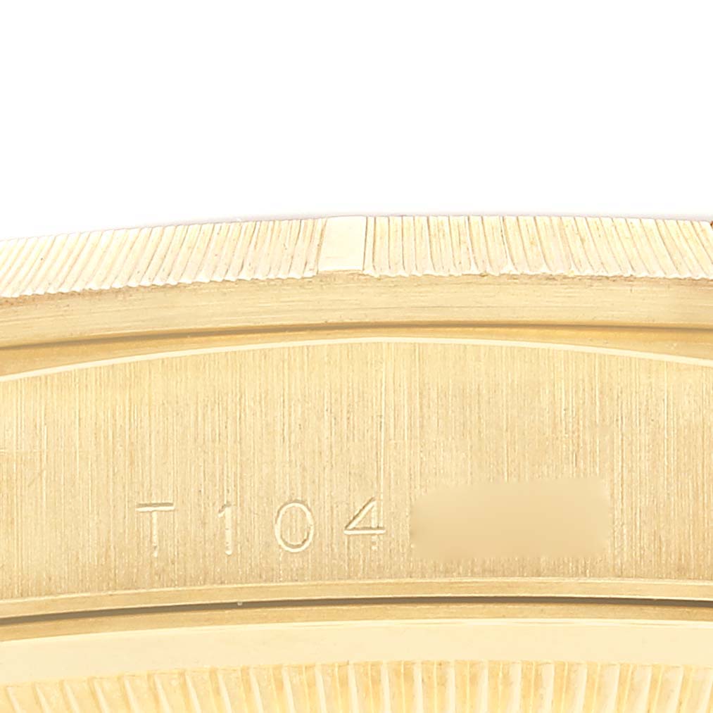 This image shows a close-up of the side of the case and the engraved serial number of a Rolex President 18248 Men
s Yellow Gold Champagne Dial 18248 Men
s Yellow Gold Champagne Dial model watch.