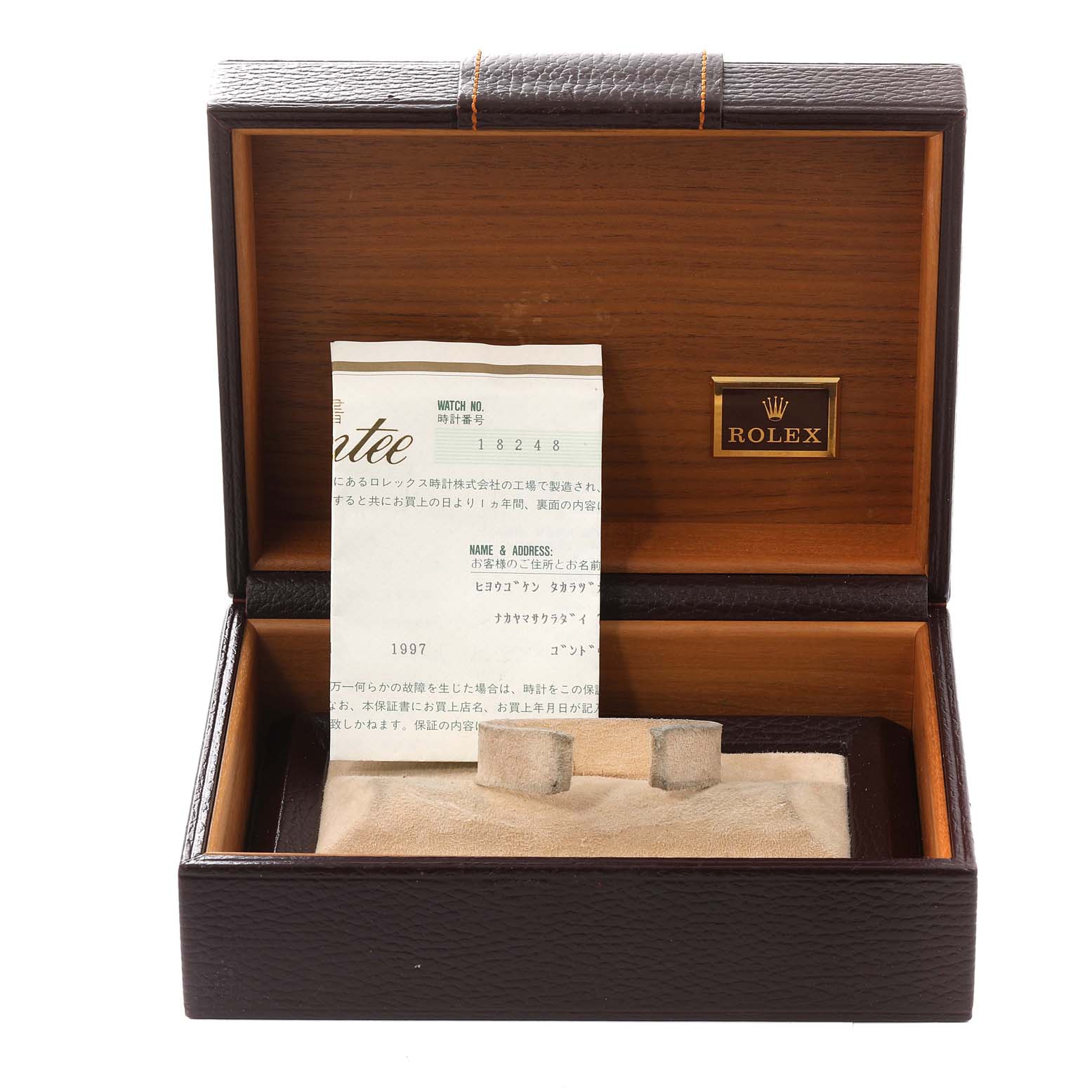 The image shows an open Rolex box with documentation for the President model.