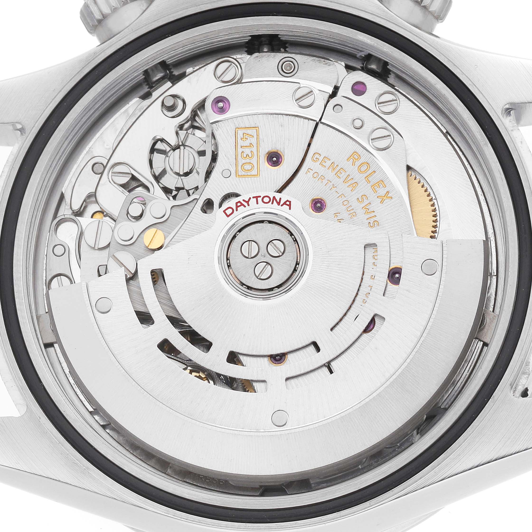 The image shows the back view of a Rolex Daytona 116520 Men's Stainless Steel White Dial, revealing its intricate movement and rotor mechanism.