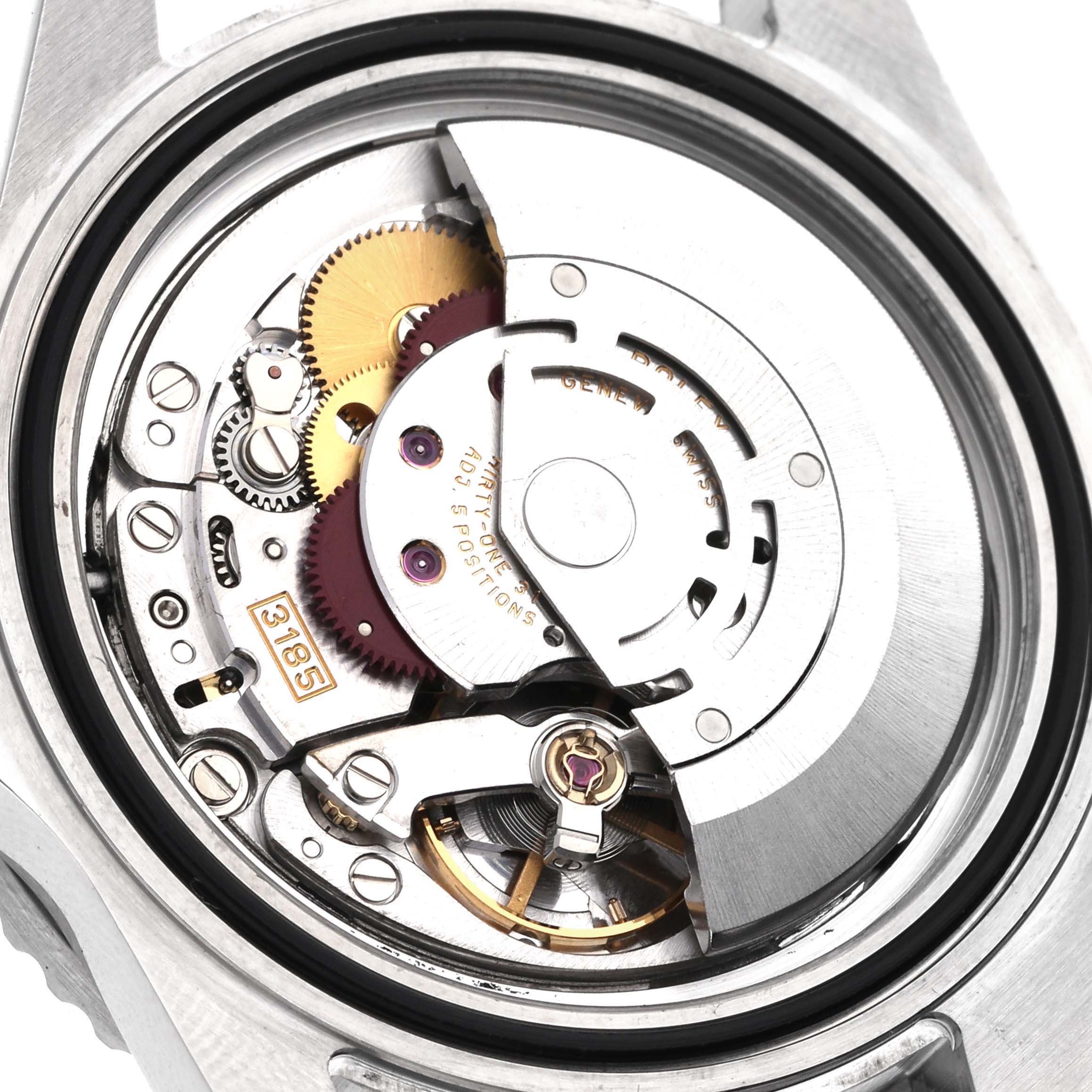The image shows the internal mechanism of a Rolex GMT-Master 16710 Men's Stainless Steel Black Dial 16710 Men's Stainless Steel Black Dial watch, highlighting gears and the movement components.