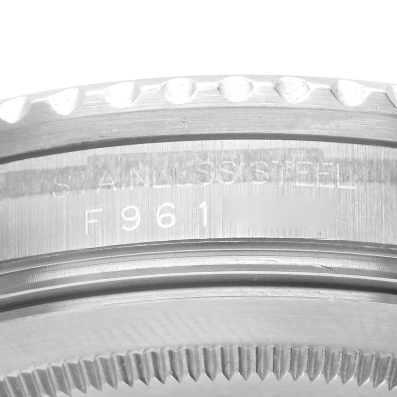 The image shows a close-up of the case side, focusing on the bezel and serial engraving of the Rolex GMT-Master 16710 Men's Stainless Steel Black Dial 16710 Men's Stainless Steel Black Dial.