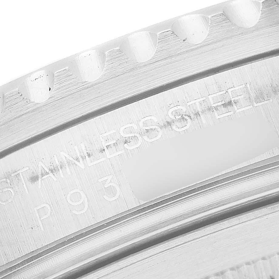 This close-up image shows the side view of the Rolex GMT-Master 16710 Men's Stainless Steel Black Dial 16710 Men's Stainless Steel Black Dial's stainless steel bezel and case with partial engraving visible.