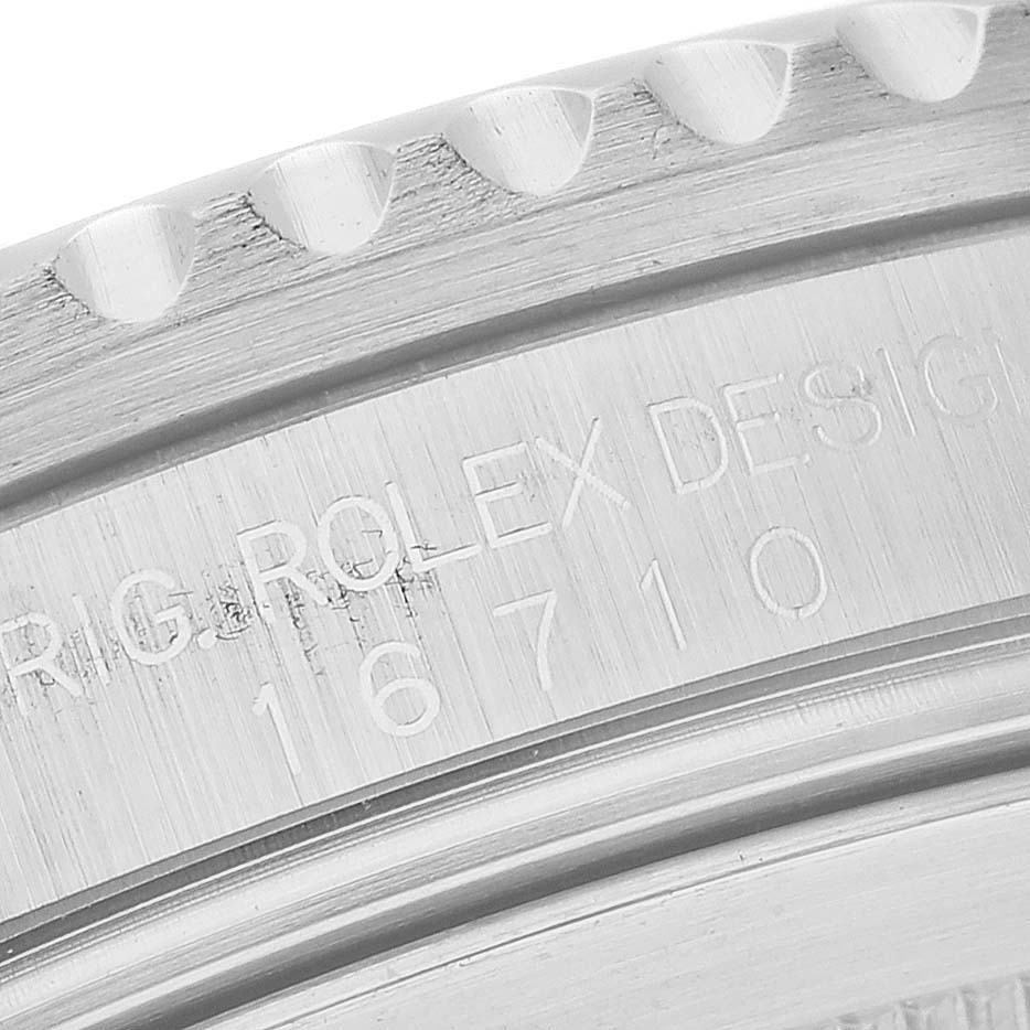 The image is a close-up angle of the bezel and case engraving of a Rolex GMT-Master 16710 Men's Stainless Steel Black Dial 16710 Men's Stainless Steel Black Dial model 16710.