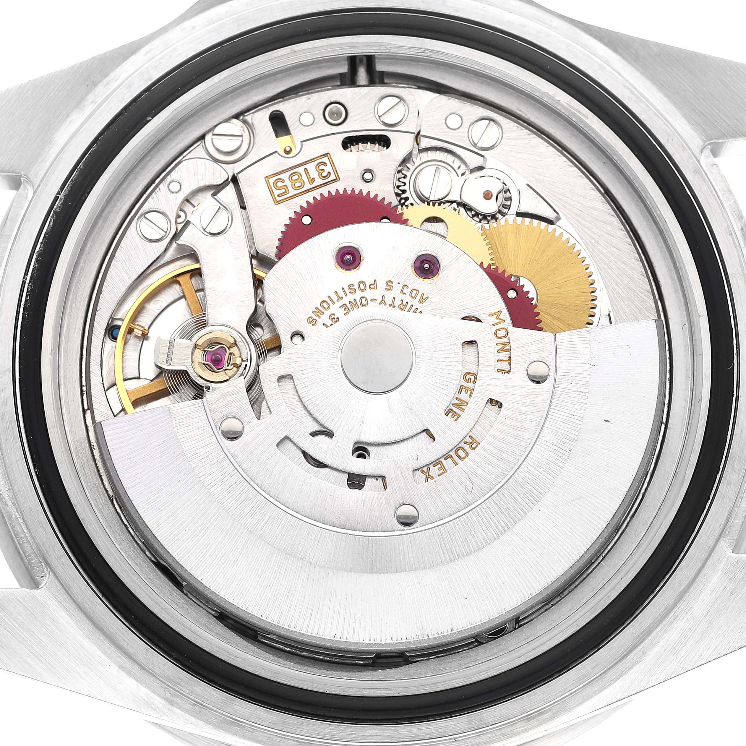 The image shows the open case back view of a Rolex GMT-Master 16710 Men
s Stainless Steel Black Dial 16710 Men
s Stainless Steel Black Dial, revealing the internal movement and gears.