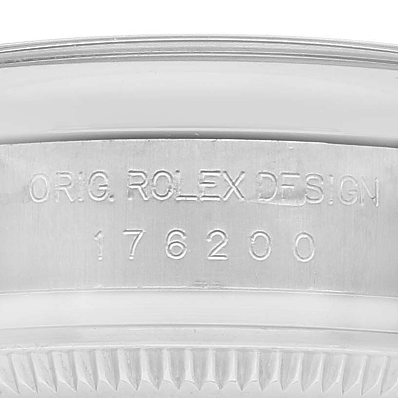 This image shows the edge and serial number engraving on the Rolex Oyster Perpetual 176200 Women's Stainless Steel Black Dial 176200 Women's Stainless Steel Black Dial model.
