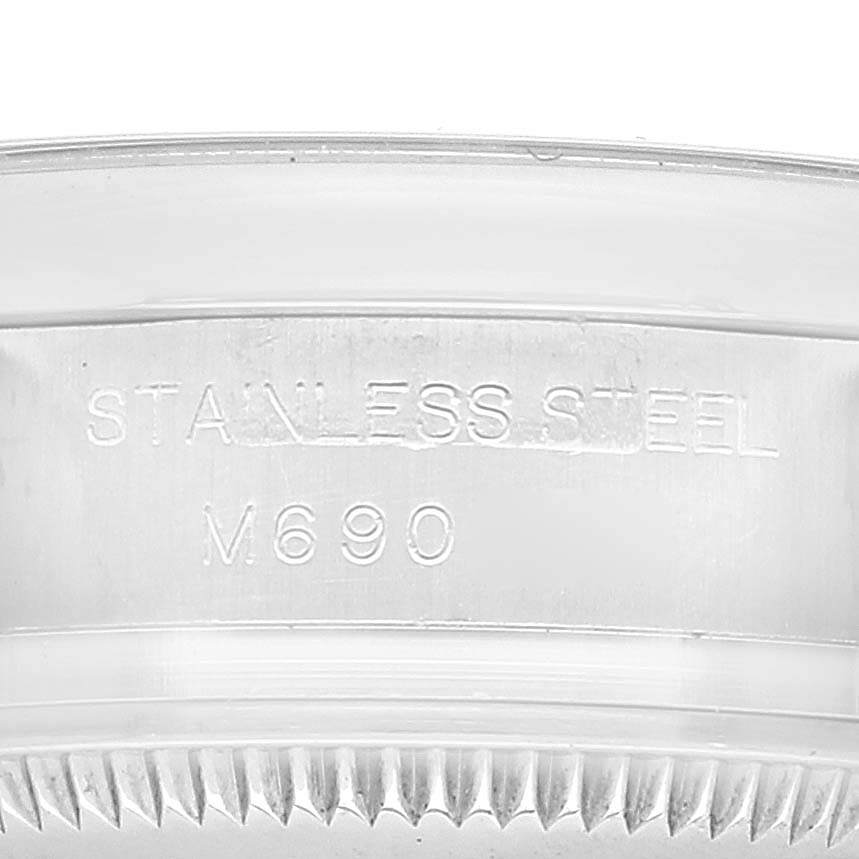 The image shows a close-up view of the stainless steel bezel and edge of the case back of a Rolex Oyster Perpetual 176200 Women's Stainless Steel Black Dial 176200 Women's Stainless Steel Black Dial watch.