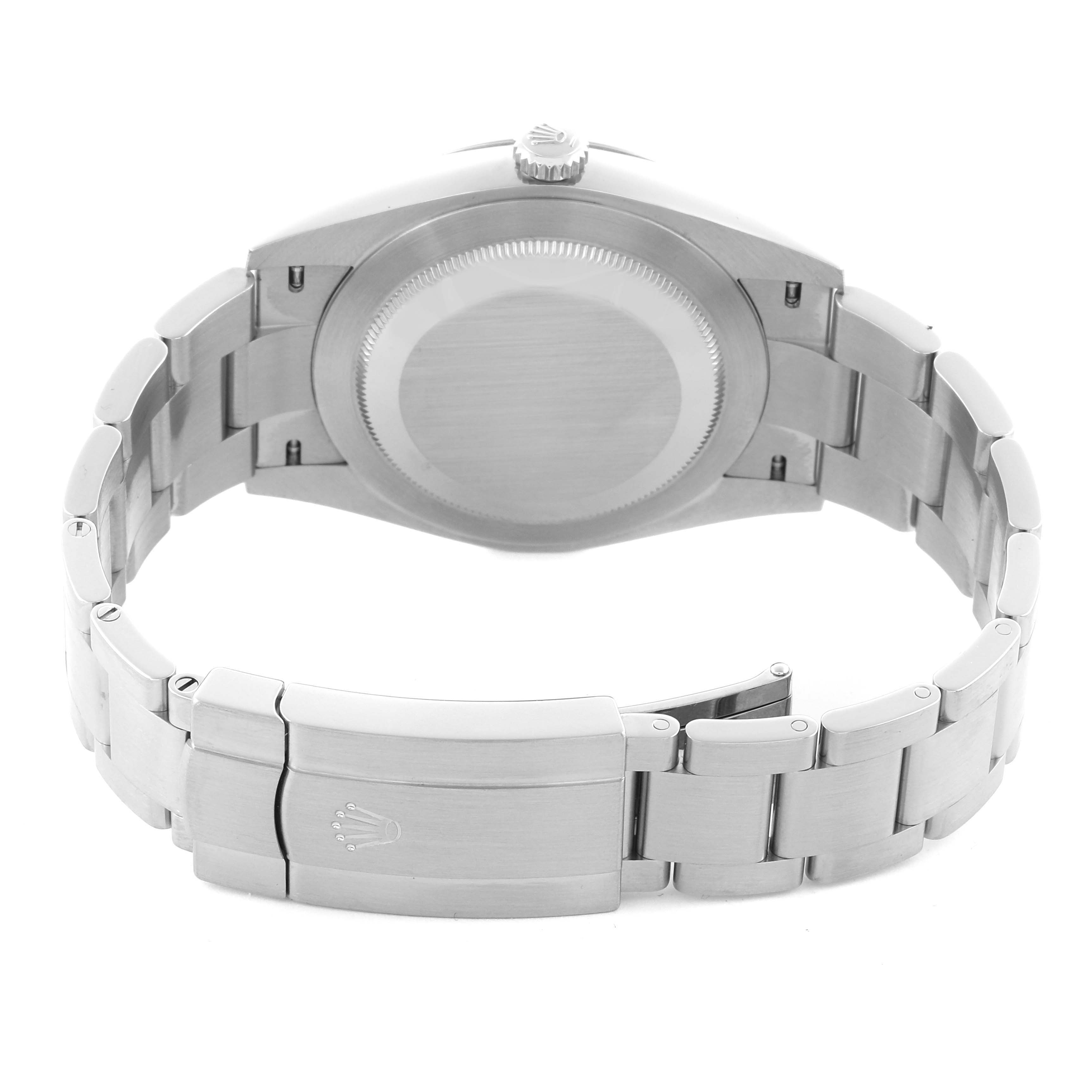 The image shows the back view of a Rolex Oyster Perpetual 124300 Men
s Stainless Steel Black Dial 124300 Men
s Stainless Steel Black Dial watch focusing on its case back and clasp.