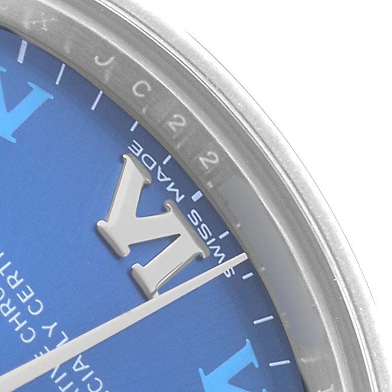 The image shows a close-up of the dial and bezel of a Rolex Mid-Size 177200 Women's Stainless Steel Blue Dial watch, focusing on the "Swiss Made" text and indices.