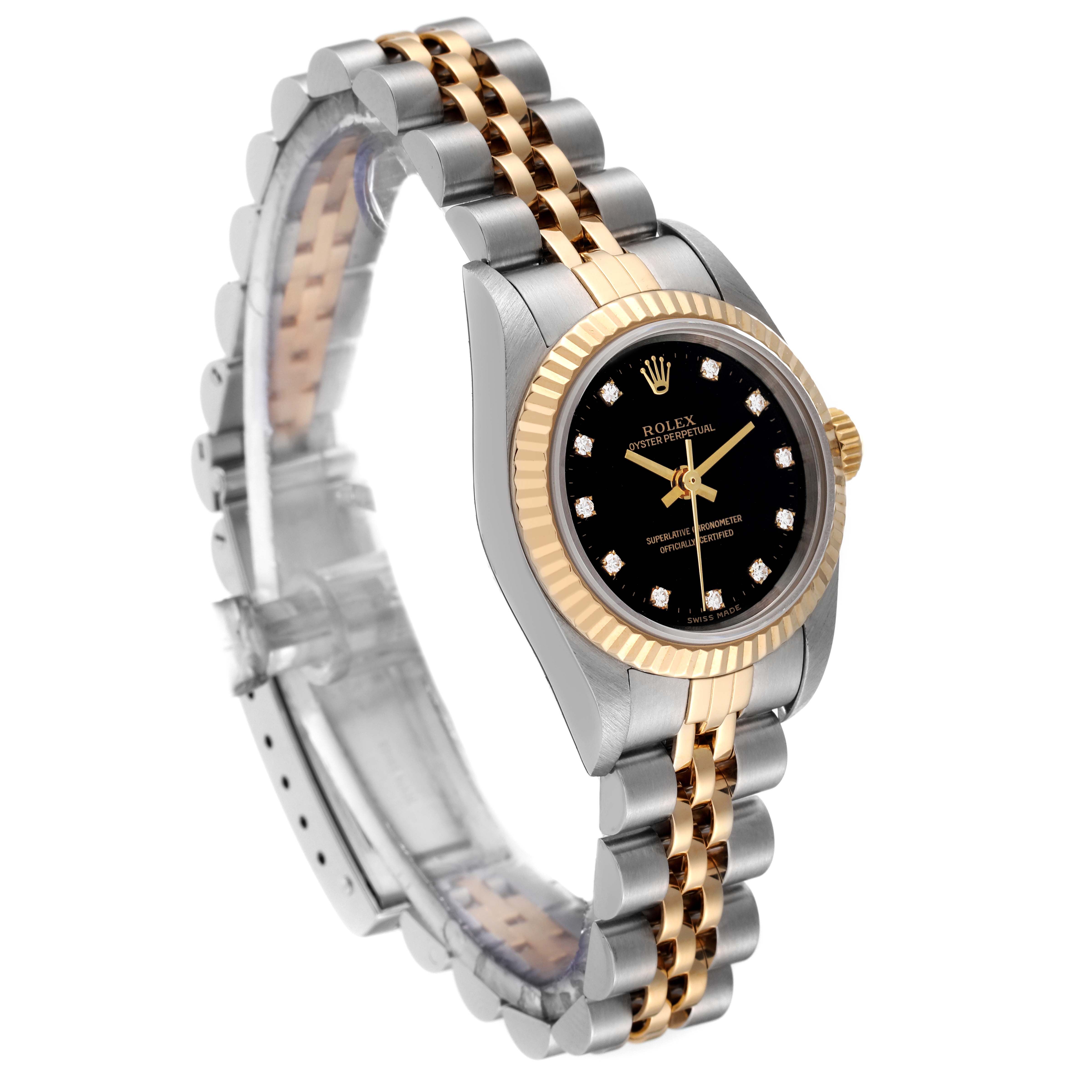 The image shows a side view of a Rolex Oyster Perpetual 76193 Women's Steel and Gold (two tone) Black Dial 76193 Women's Steel and Gold (two tone) Black Dial watch, highlighting its two-tone metal bracelet and black dial with diamond hour markers.