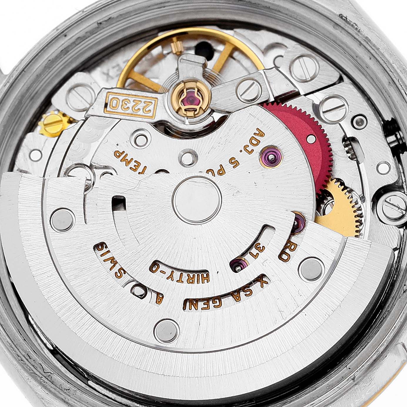 The image shows a close-up view of the movement mechanism of a Rolex Oyster Perpetual 76193 Women's Steel and Gold (two tone) Black Dial 76193 Women's Steel and Gold (two tone) Black Dial watch.