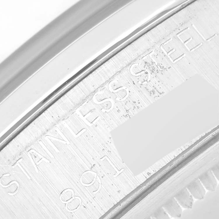 The image shows a close-up of the stainless steel back casing with partial serial number details of a Rolex Vintage Collection 6694 Men's Stainless Steel Black Dial 6694 Men's Stainless Steel Black Dial watch.