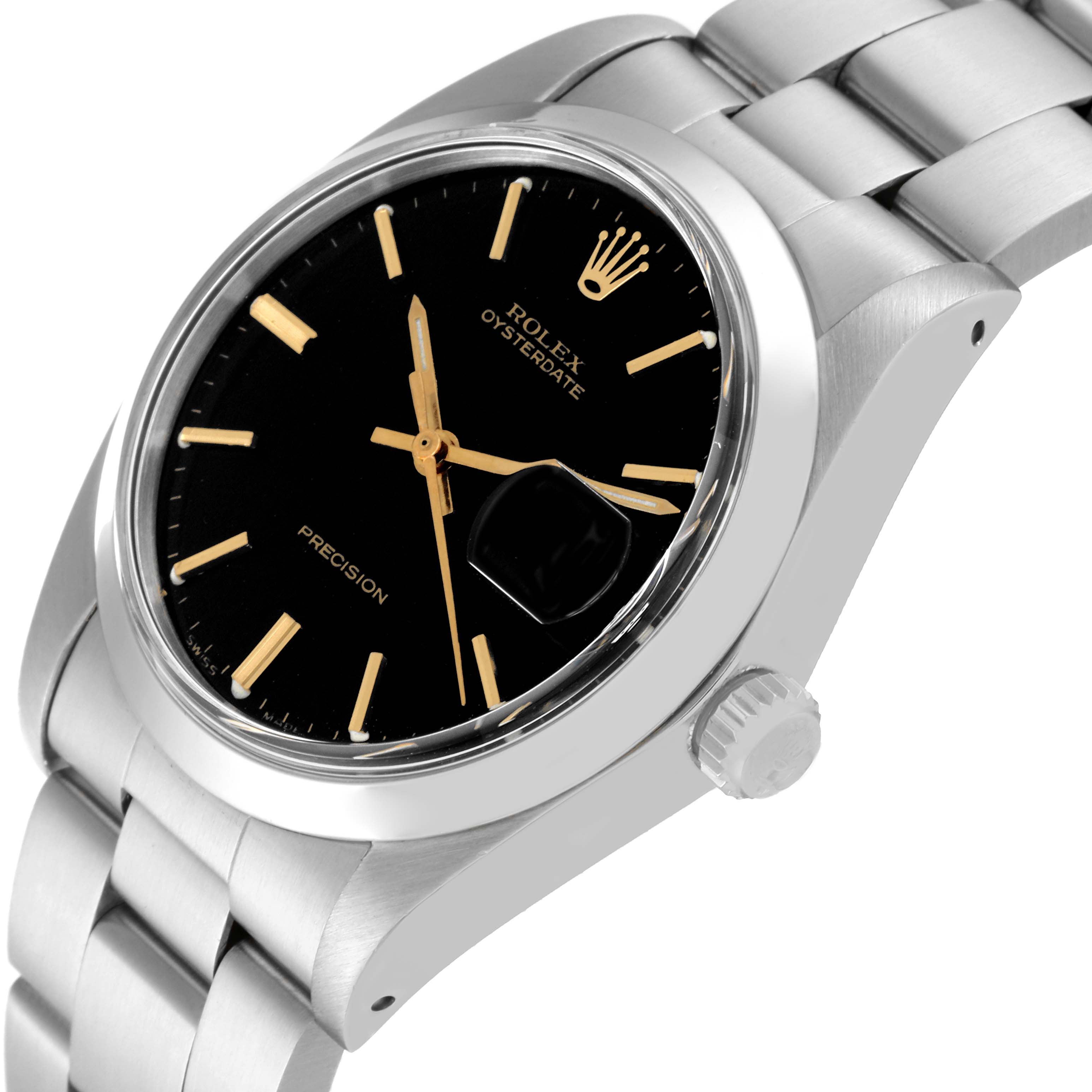 This angled shot shows the Rolex Vintage Collection 6694 Men's Stainless Steel Black Dial 6694 Men's Stainless Steel Black Dial Oysterdate watch face, bezel, crown, and part of the bracelet.