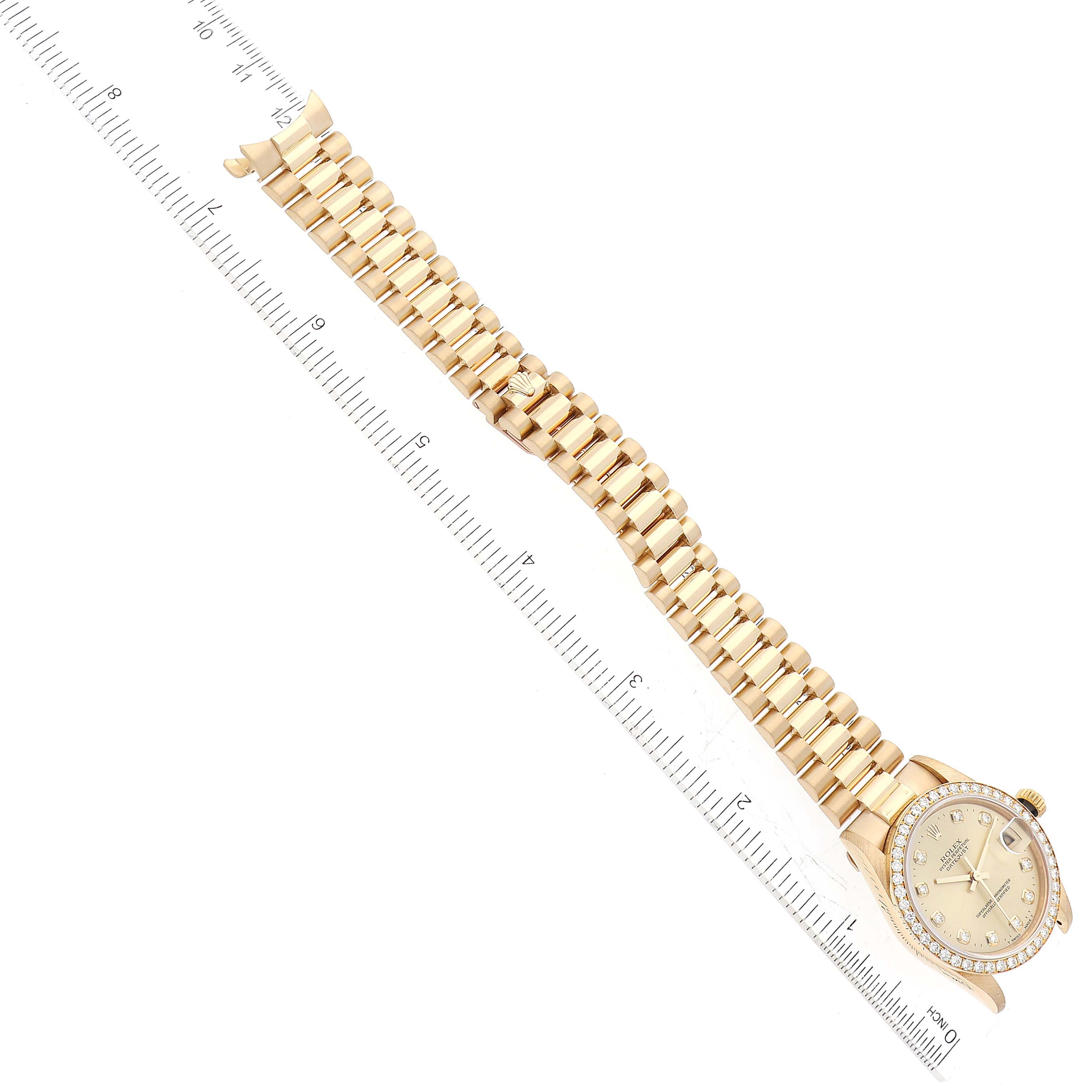This image shows a top-down view of a Rolex President 68288 Women's Yellow Gold Champagne Dial 68288 Women's Yellow Gold Champagne Dial model watch with its full gold bracelet and bezel.