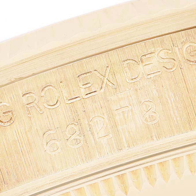 The image shows the engraved case and model number of a Rolex President 68278 Women's Yellow Gold White Dial 68278 Women's Yellow Gold White Dial watch, viewed at a close-up angle.