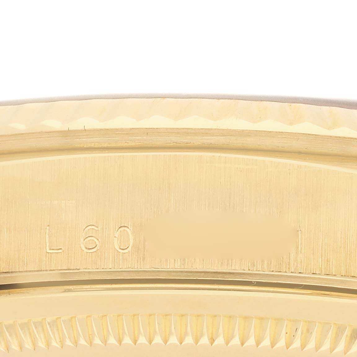 The image shows a close-up of the Rolex President 18238 Men's Yellow Gold Champagne Dial model watch's side, highlighting the case detail and engraving.