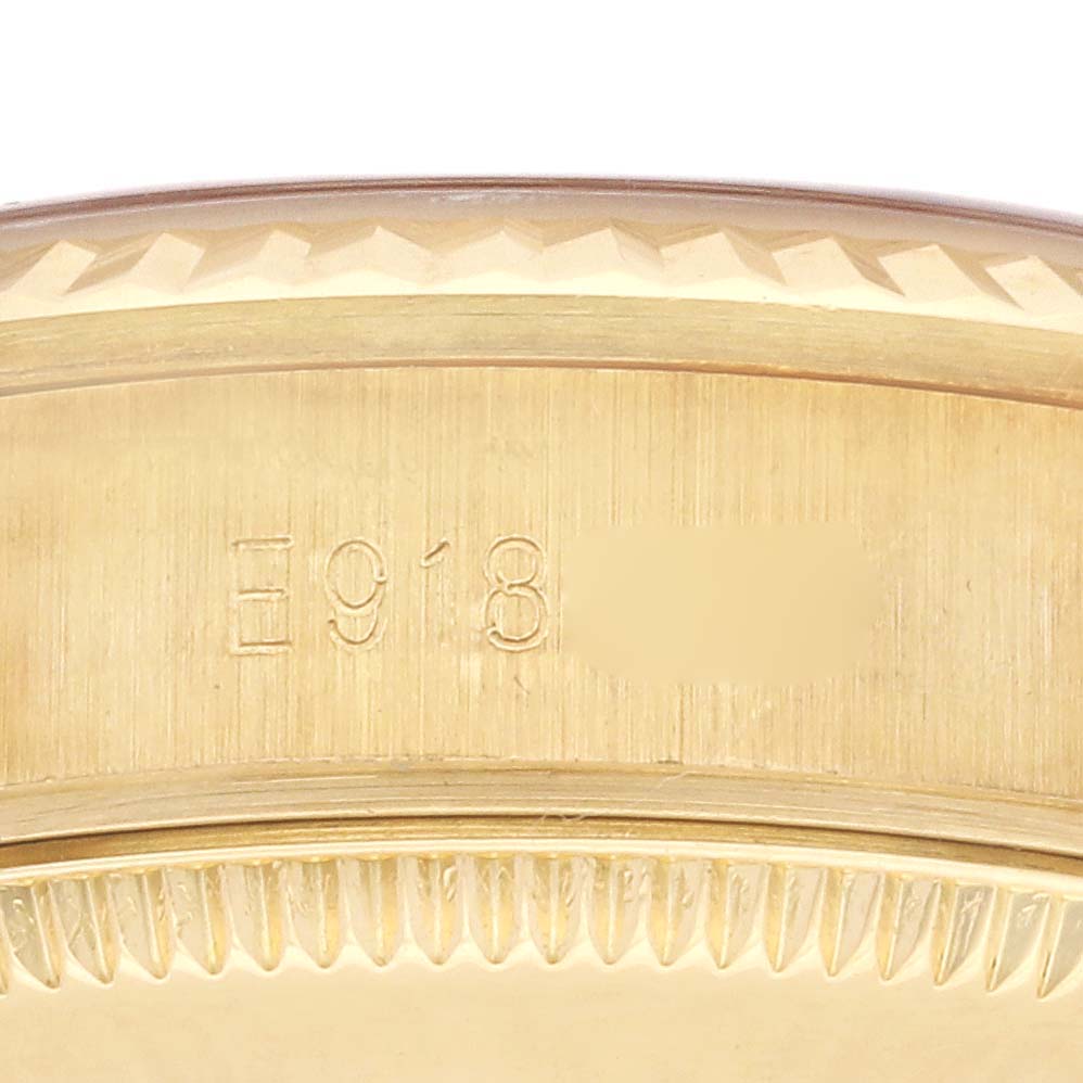 The image shows a close-up of the case side and serial number on a Rolex President 68238 Women's Yellow Gold Champagne Dial 68238 Women's Yellow Gold Champagne Dial watch.