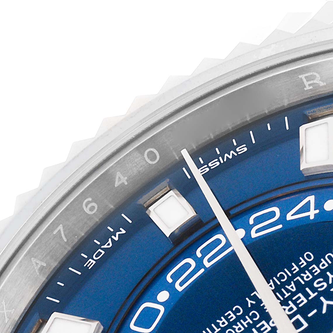 This close-up of the Rolex Sky-Dweller 326934 Men's Stainless Steel Blue Dial 326934 Men's Stainless Steel Blue Dial watch shows part of the blue dial, indices, GMT ring, and the unique bezel.