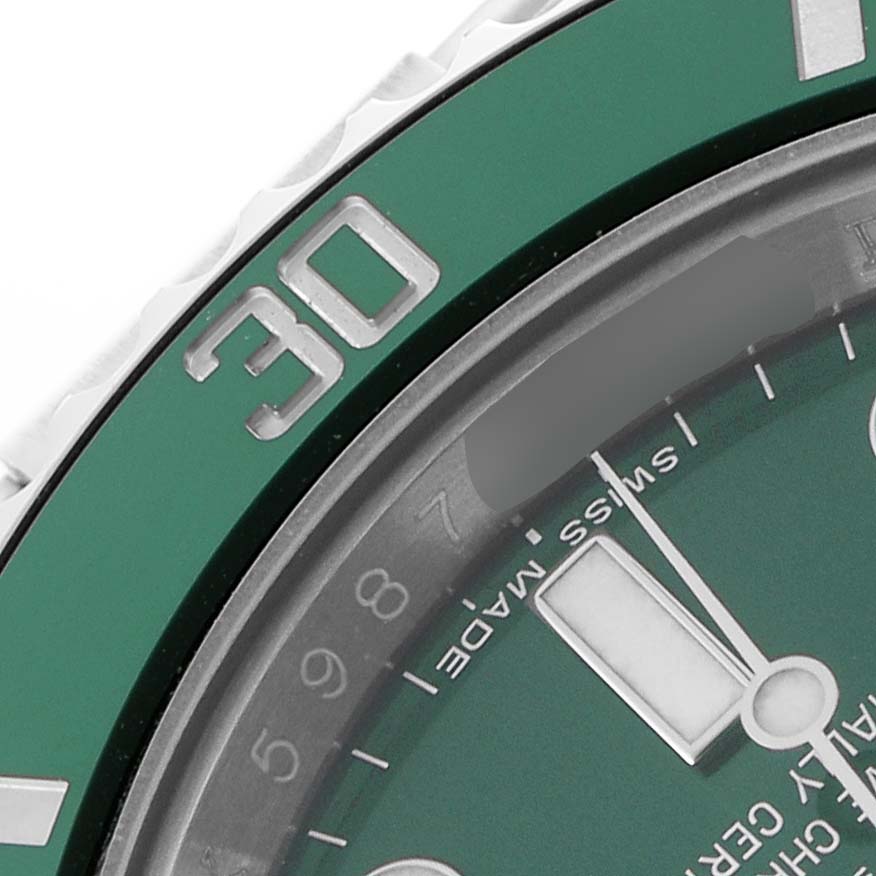 The image shows a close-up of the bezel and part of the dial of the Rolex Submariner 116610LV Men's Stainless Steel Green Dial.