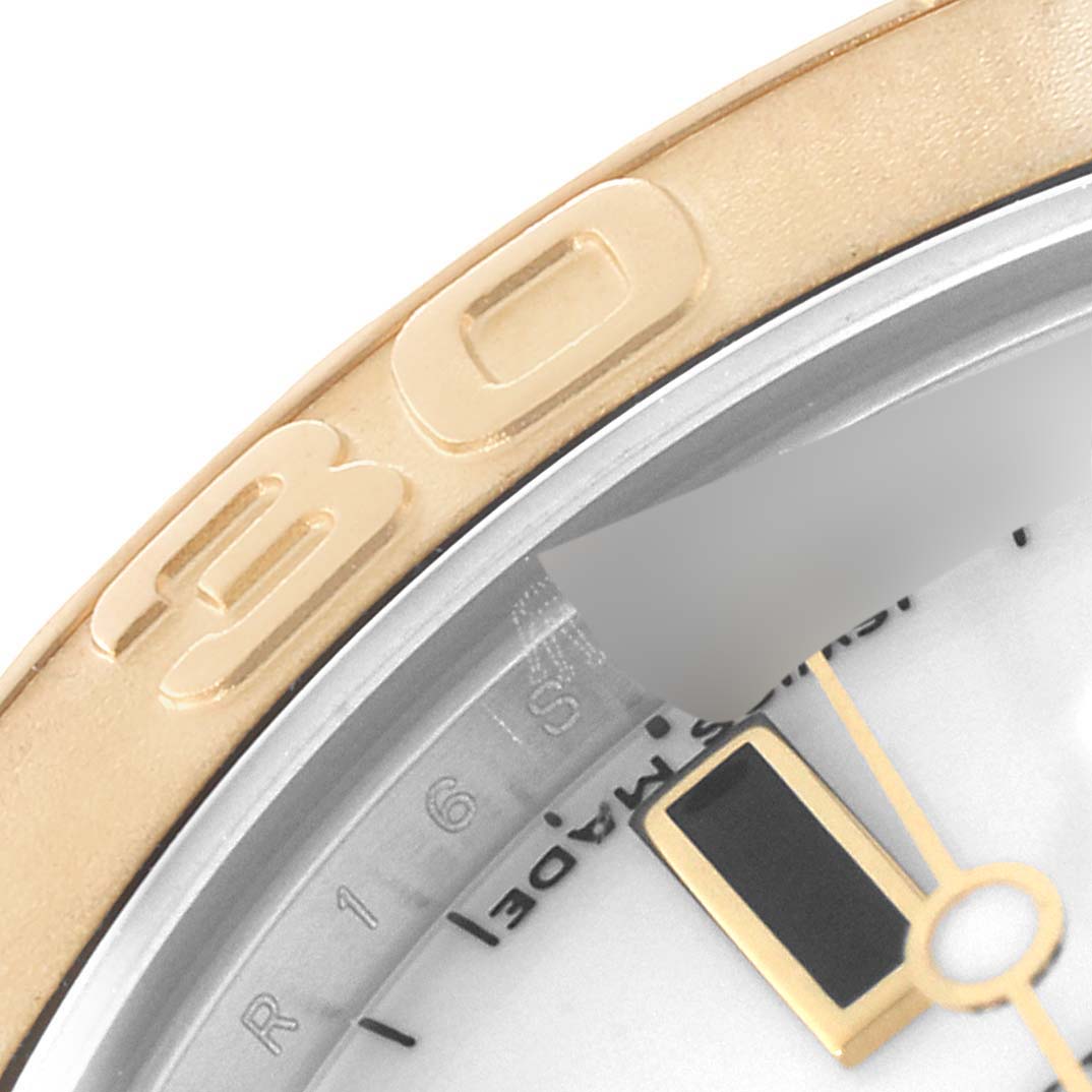 The image shows a close-up of the bezel and minute hand of a Rolex Yacht-Master 168623 Women's Steel and Gold (two tone) White Dial 168623 Women's Steel and Gold (two tone) White Dial watch.