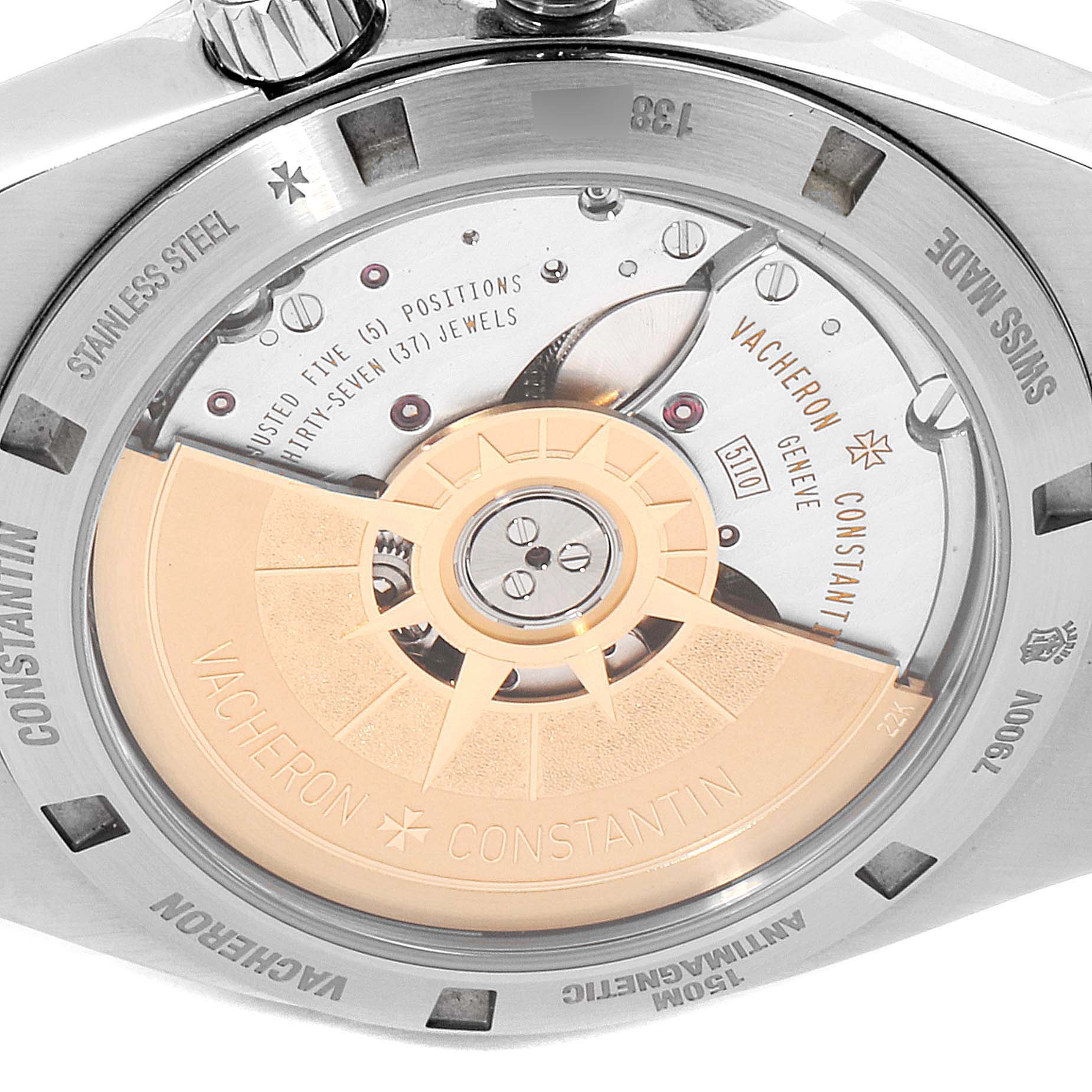 The image shows the back view of a Vacheron Constantin Overseas 7900V/110A-B334 Men's Stainless Steel Blue Dial 7900V/110A-B334 Men's Stainless Steel Blue Dial watch, showcasing its exposed movement and engravings.