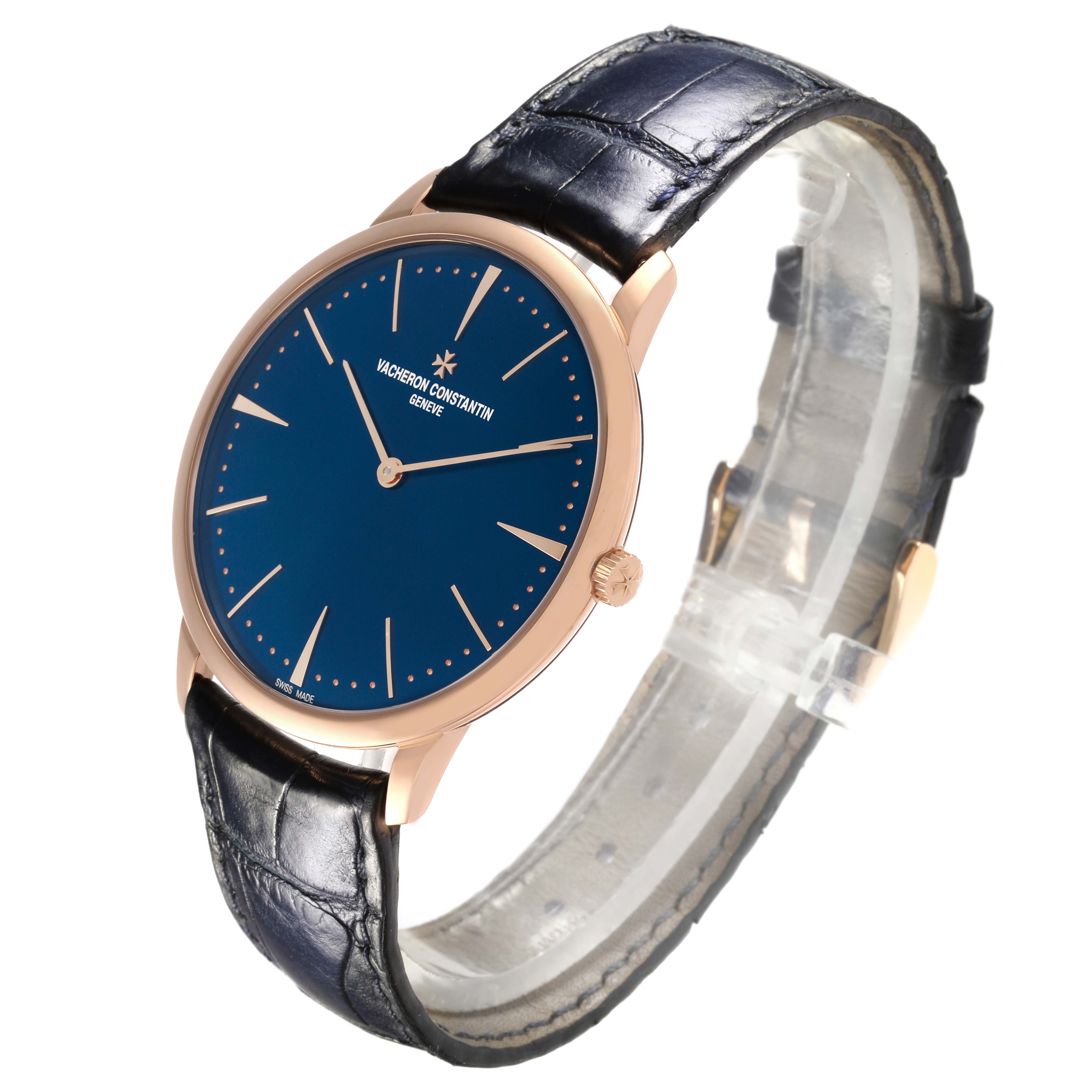 The Vacheron Constantin Patrimony 81180/000R-B518 Men's Rose Gold Blue Dial 81180/000R-B518 Men's Rose Gold Blue Dial watch is shown from a side angle, displaying its blue dial, rose gold case, and black leather strap.