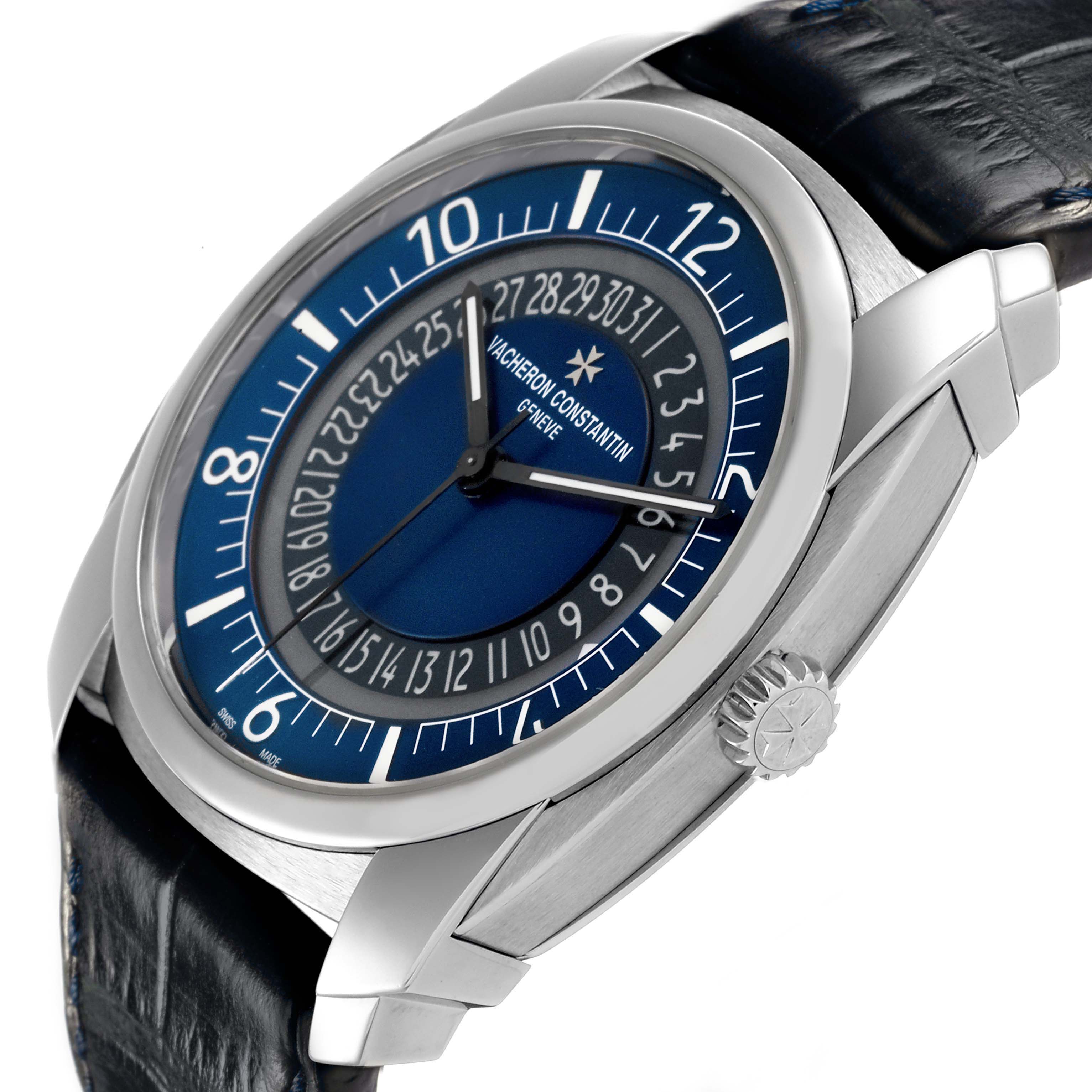 The Vacheron Constantin Quai de L'ile watch is shown at a front-side angle, highlighting the blue dial, numerals, crown, and strap.